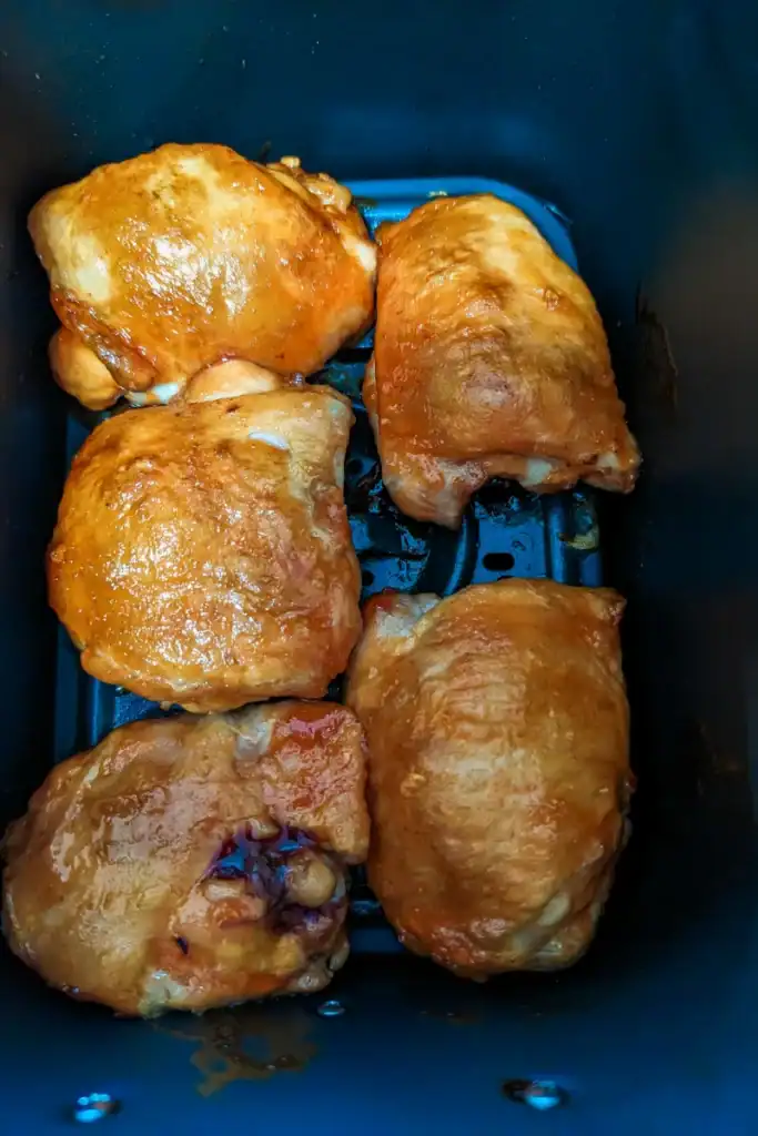 air fried chicken thighs with sauce before second coating