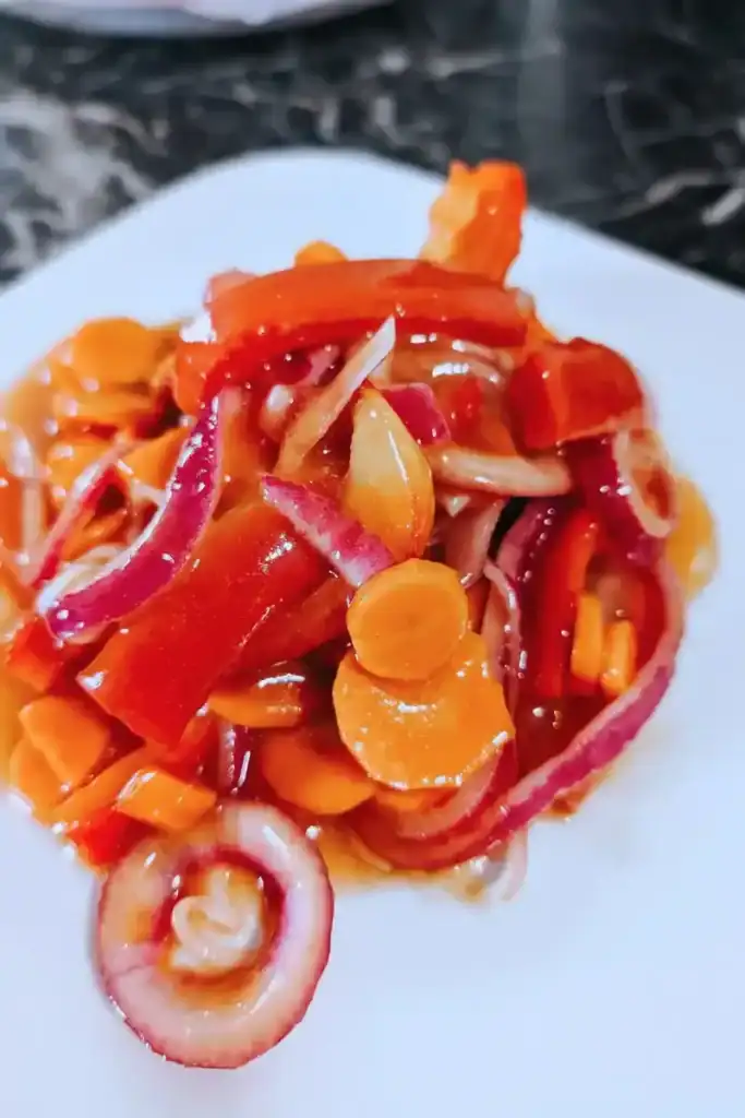 the marinated copper penny salad on a white plate
