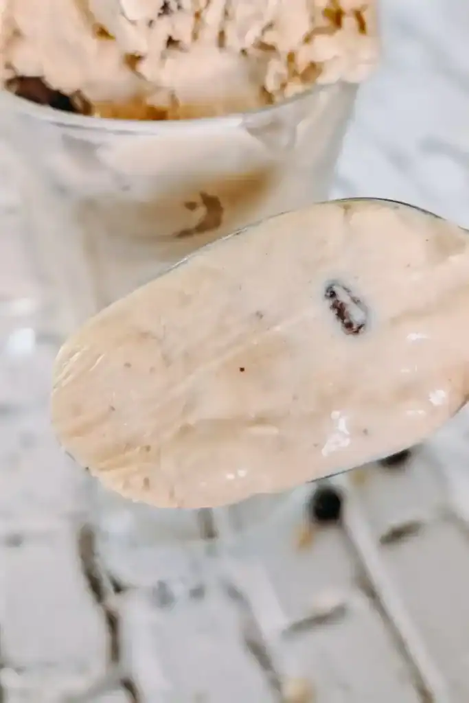 licked ice cream on spoon to show creaminess