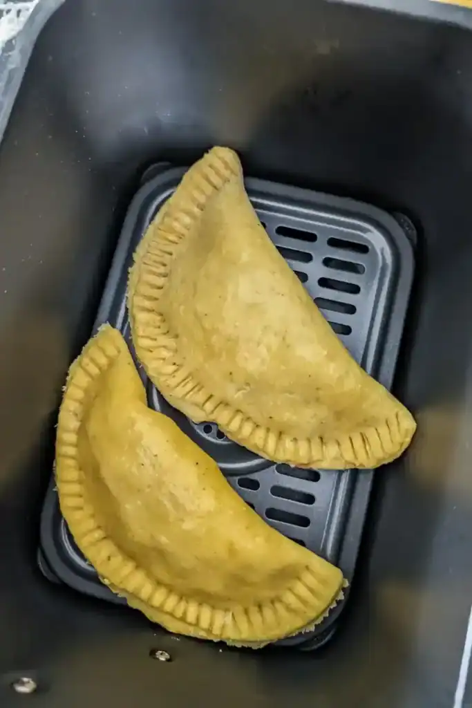 adding patties to air fryer basket