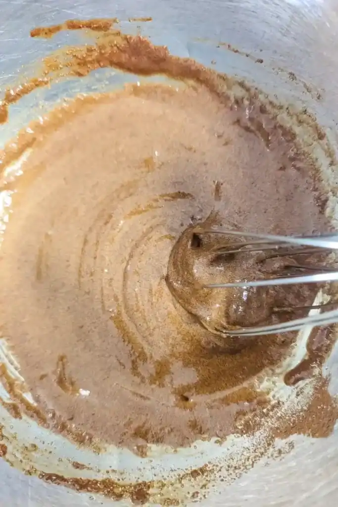 mixing in the heavy cream to coffee ice cream base