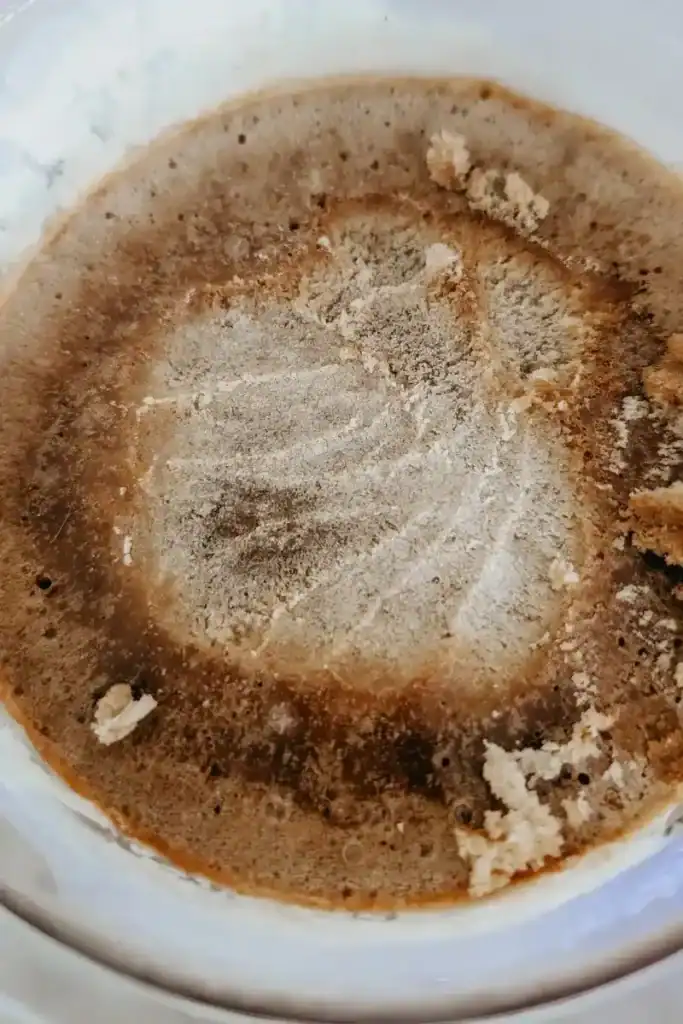 scraping the surface of the frozen ice cream flat