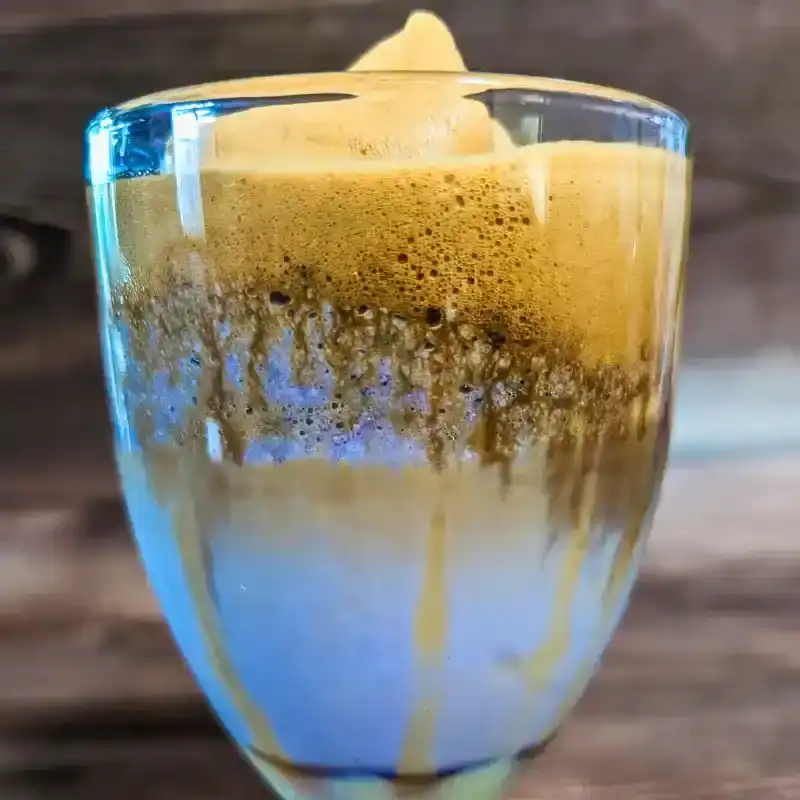 the Dalgona taro latte in a wide glass
