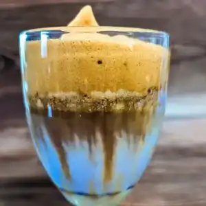 the Dalgona taro latte in a wide glass blending