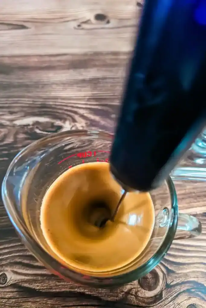 whipping the Dalgona coffee layer