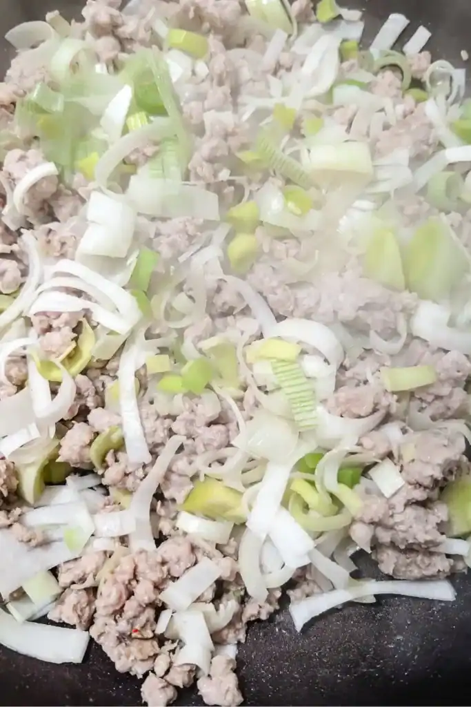 cooking leeks and sausage