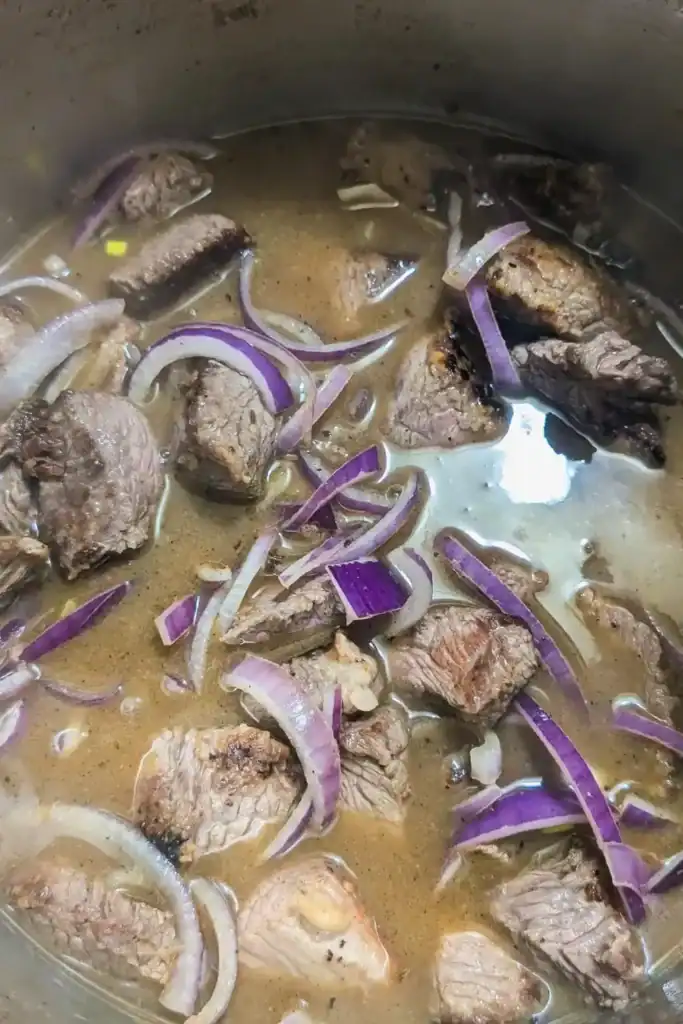 adding cold water to simmer the meat in