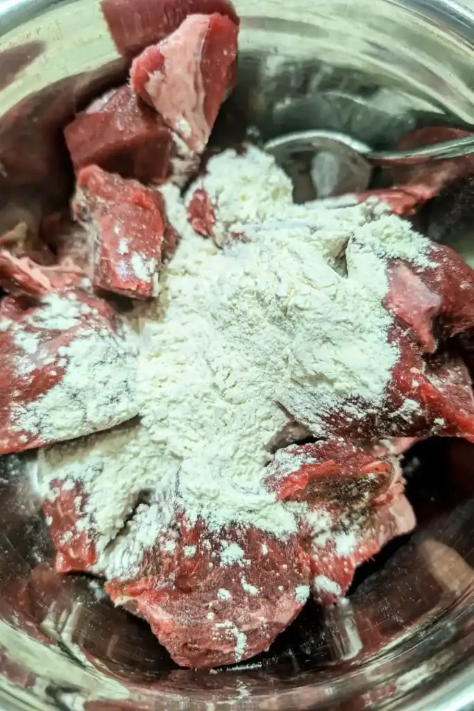 flouring the stew meat before browning