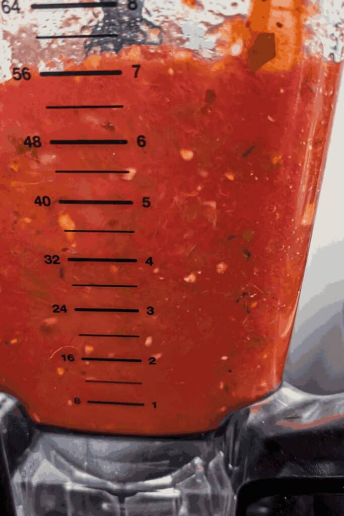 pureeing the red sauce in the Ninja blender