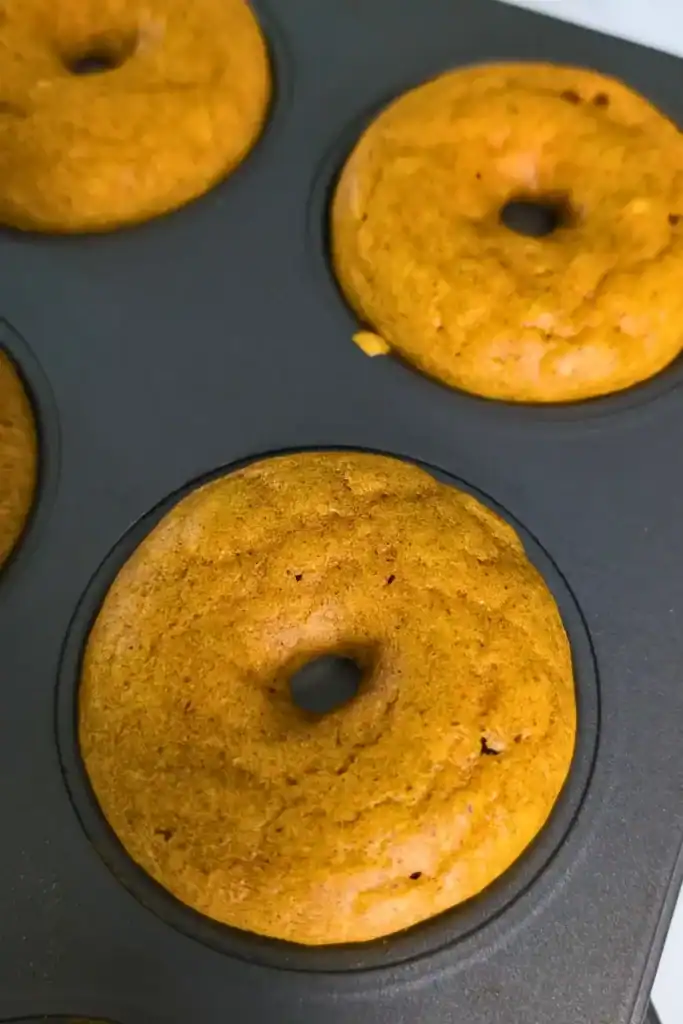 baked pumpkin donuts in donut pan