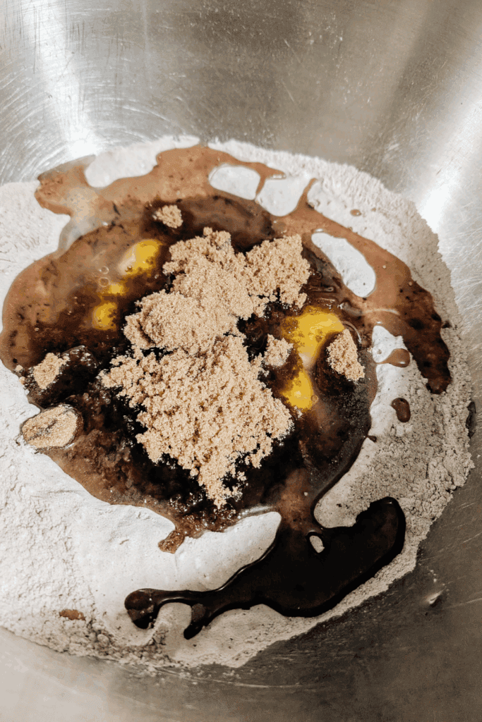 adding brown sugar to cake