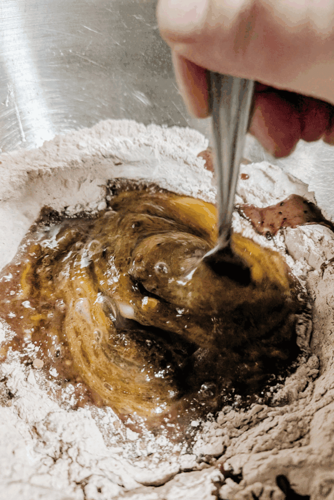 circling outwards in cake batter with fork mixing