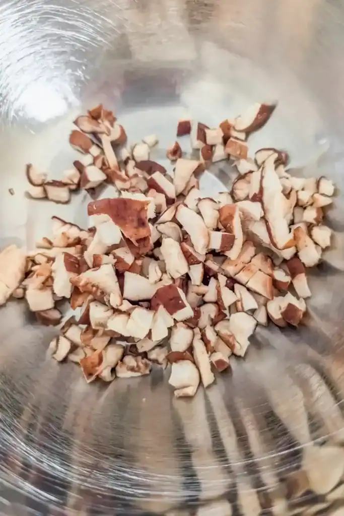 chopped shiitake mushroom in stainless steel bowl