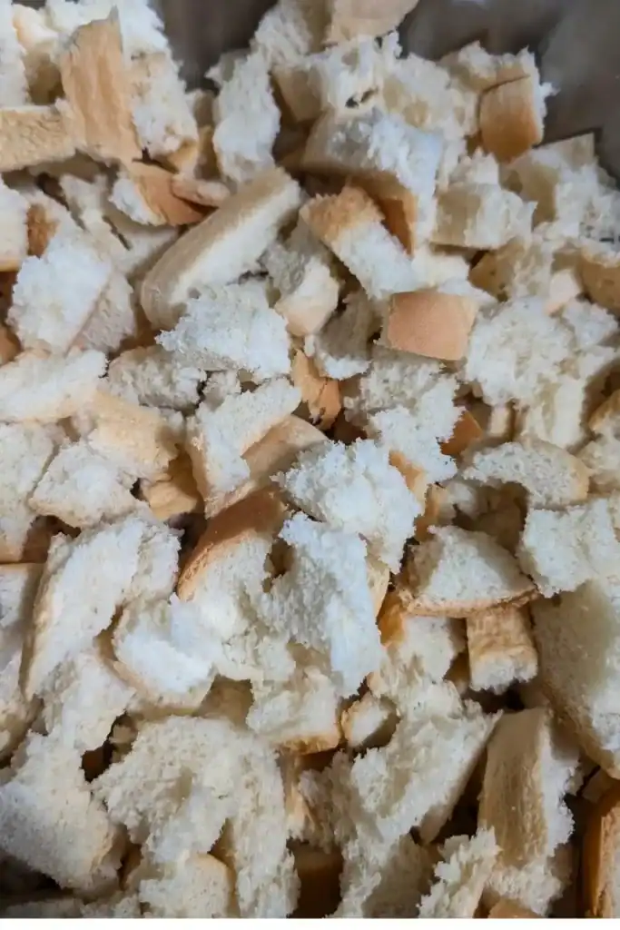 bread ripped up in mixing bowl for stuffing