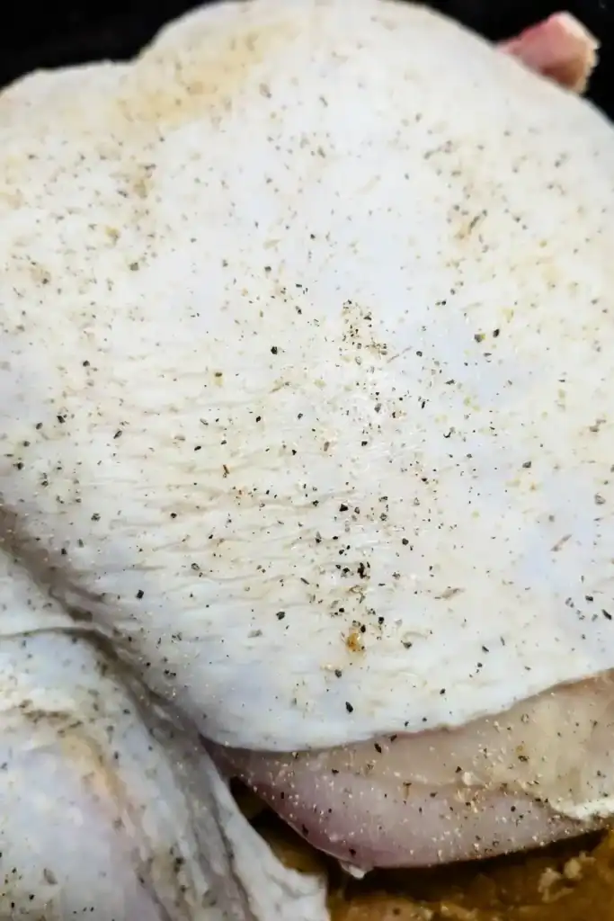 adding pepper to turkey