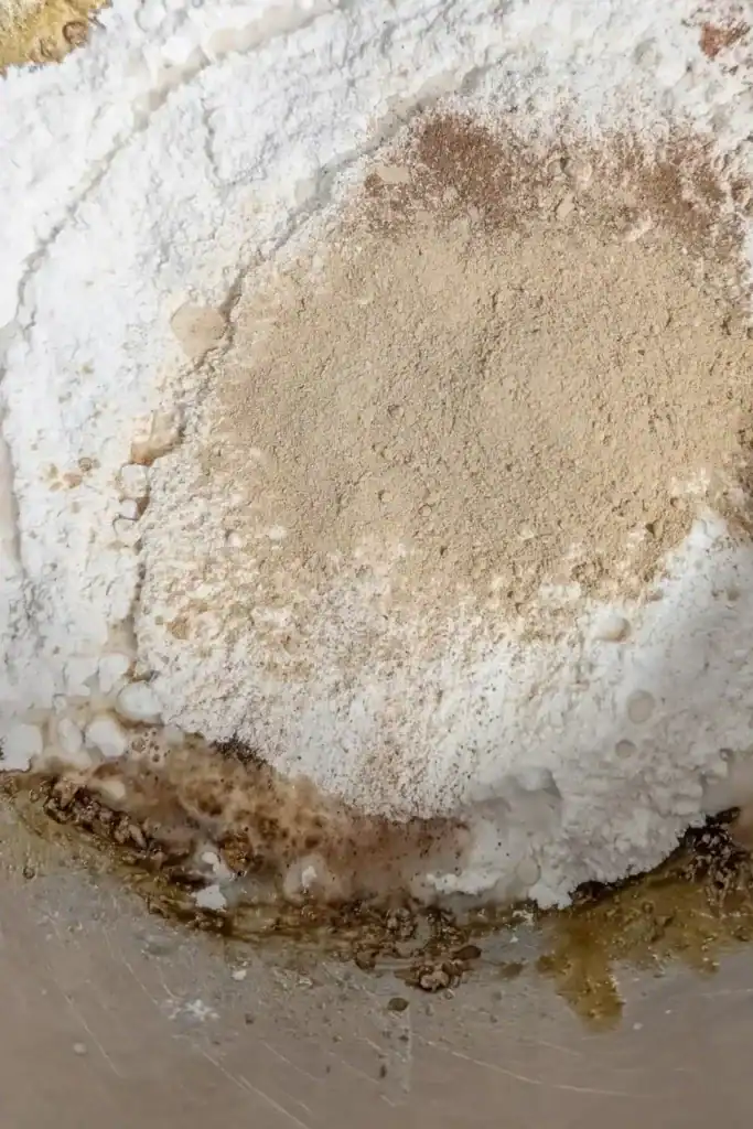 adding powdered ginger to the gingerbread batter
