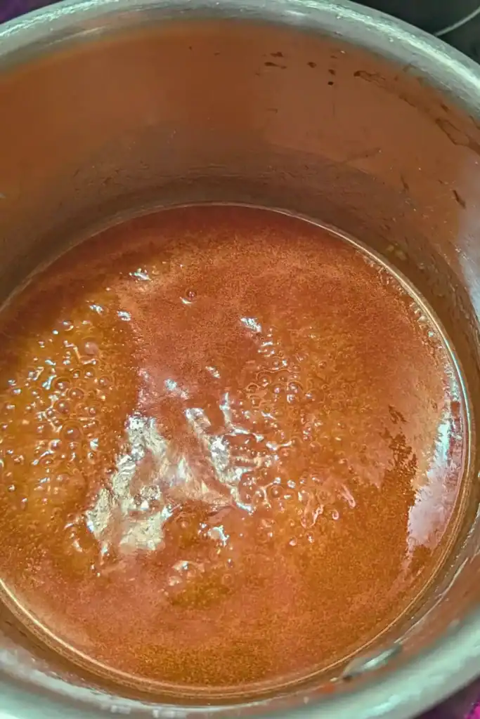 the sweet and sour sauce at a rolling boil