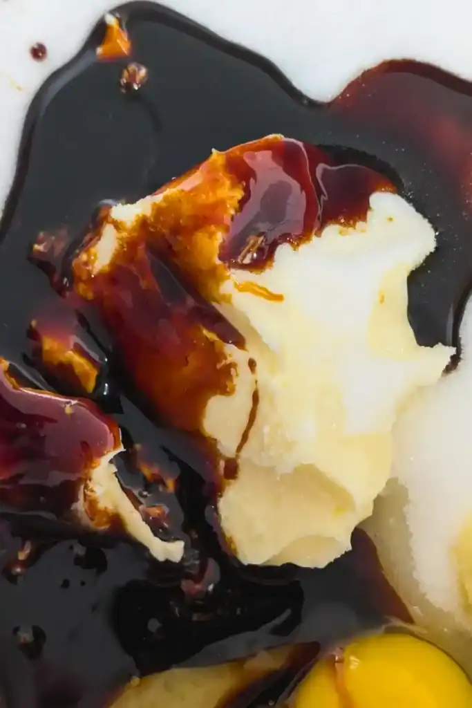 adding molasses to the butter sugar cream