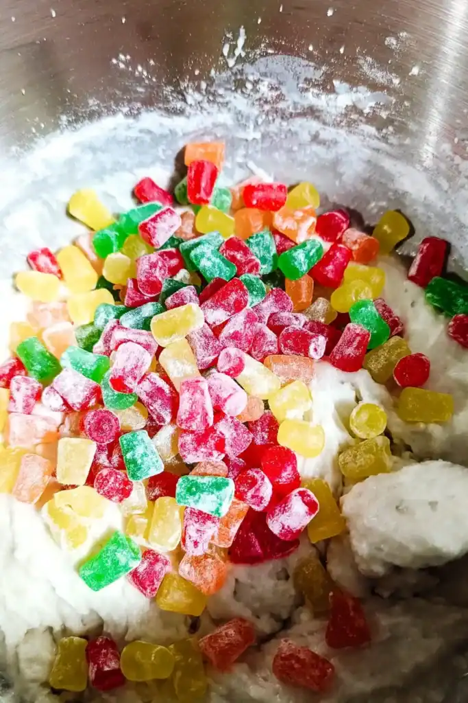 adding floured baking gums to cake batter