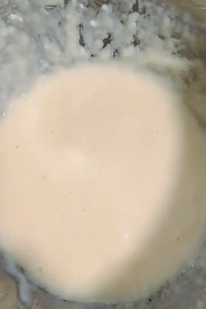 beating sour cream and eggs to another bowl