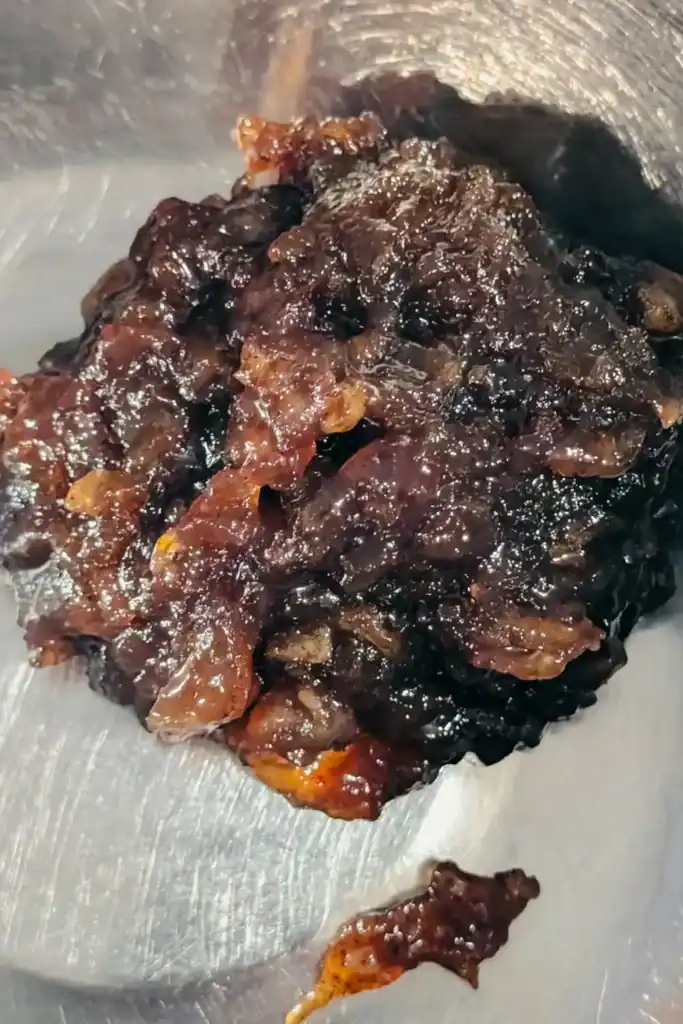 thickened cooled apple butter in stainless steel bowl
