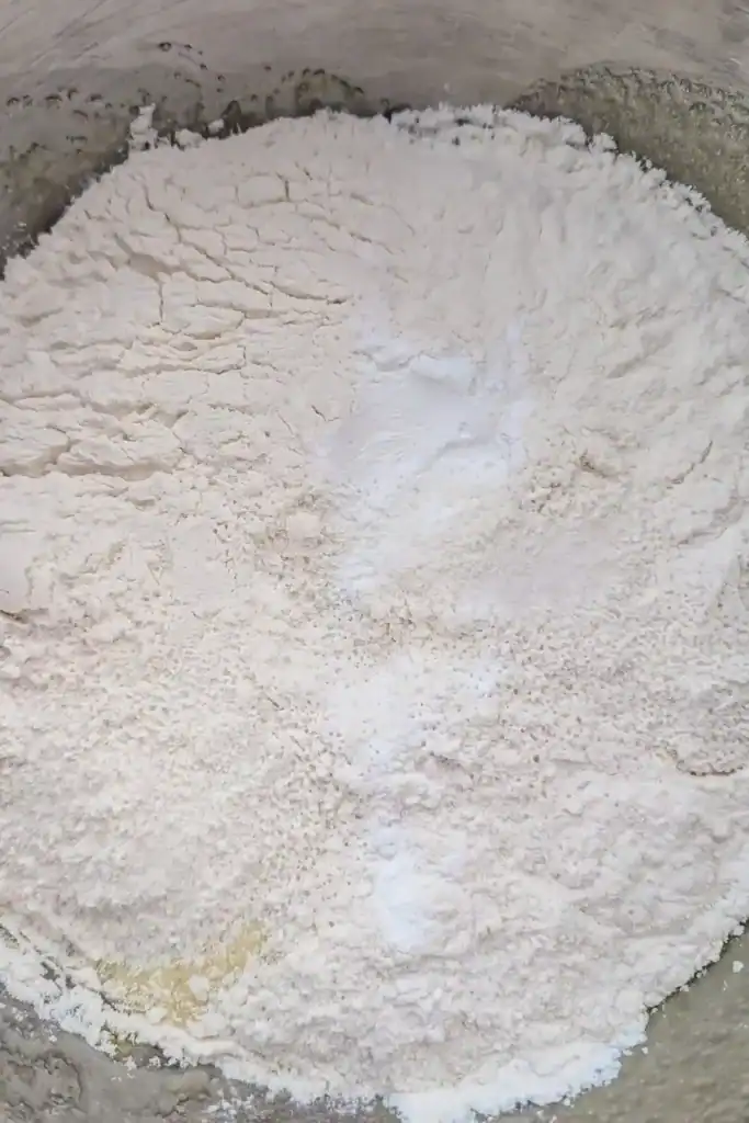 adding dry ingredients to wet