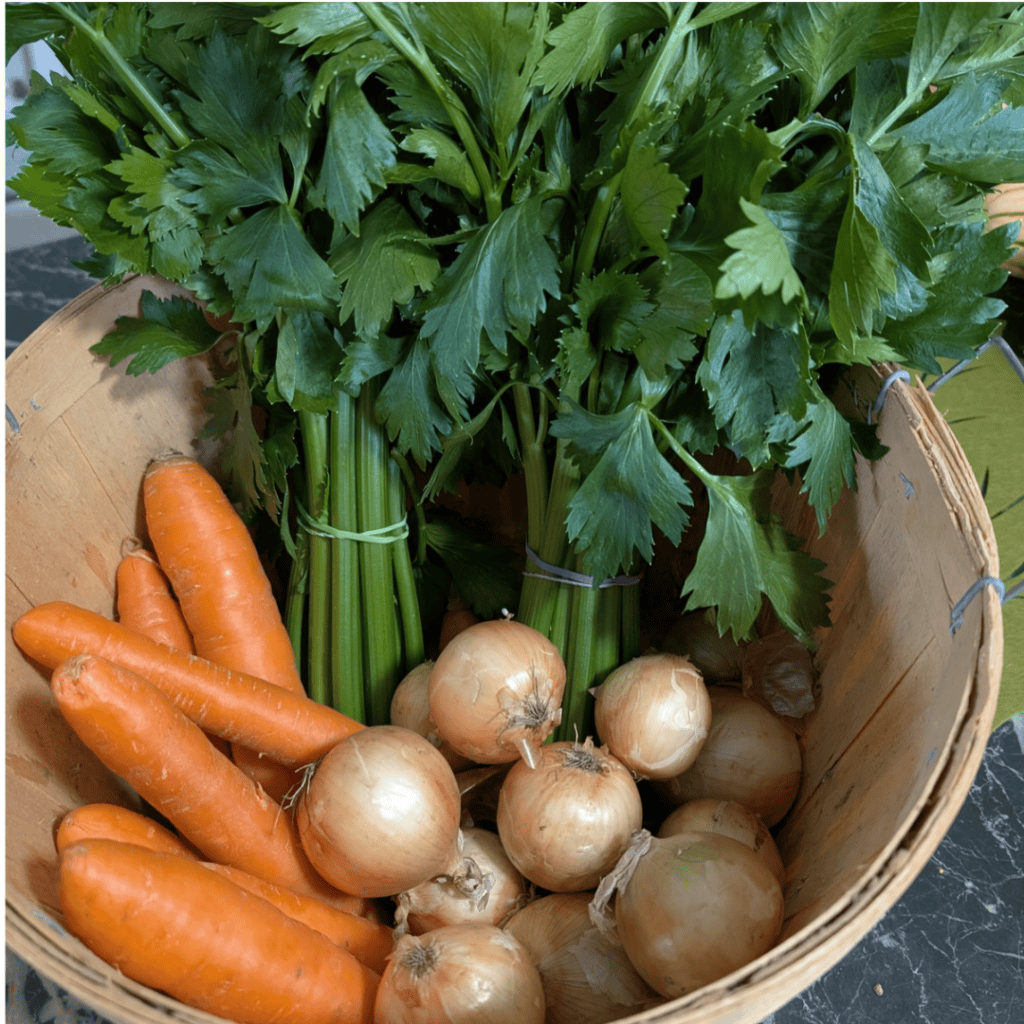 celery carrots and onions in bushel basket