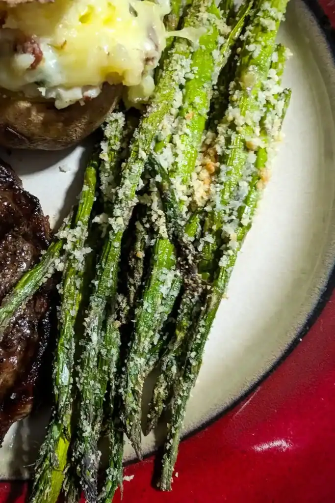 laying asparagus spears in air fryer basket