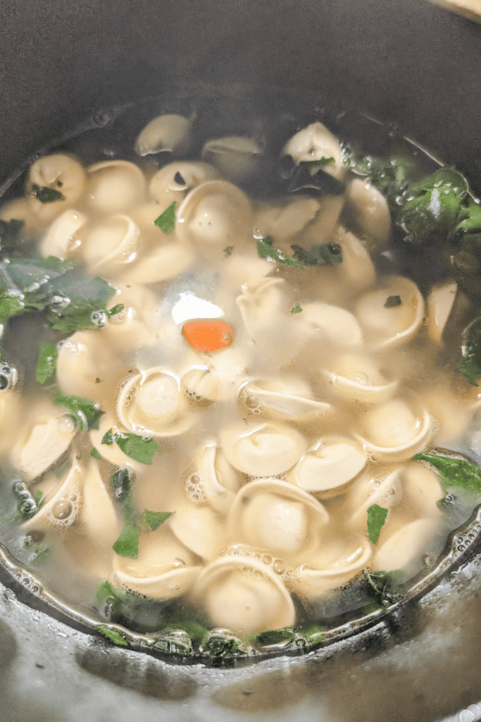 cooking the cappelletti in the soup