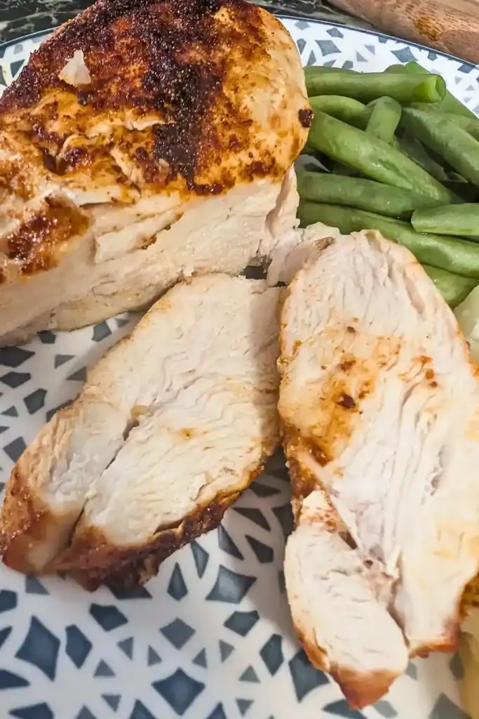 air fryer chicken breast sliced on dinner plate