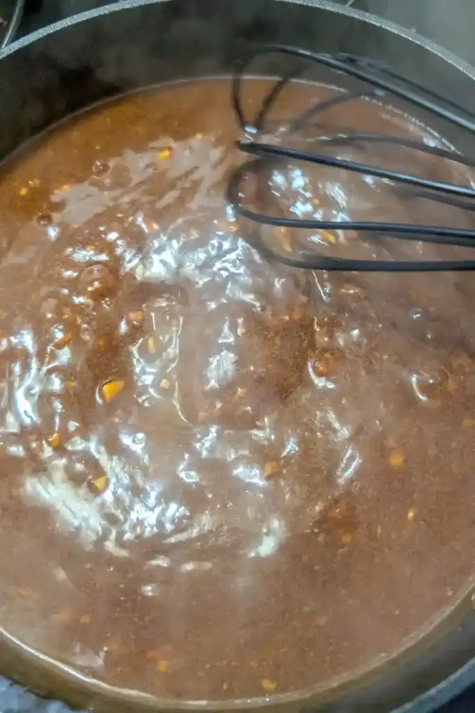 whisking sauce to thicken