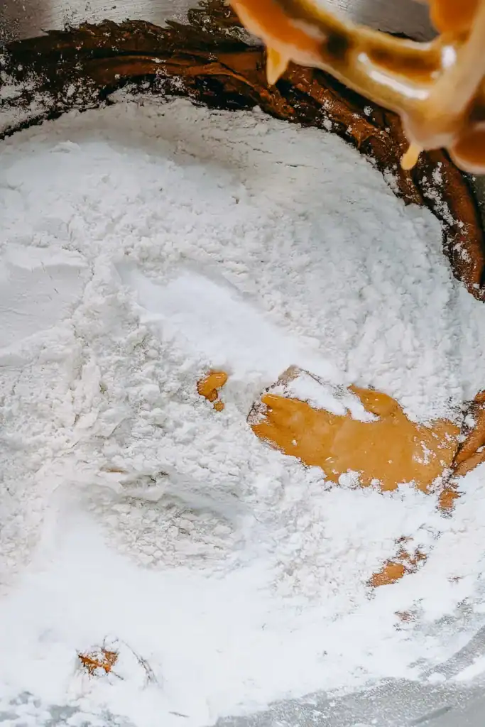 adding dry ingredients to wet for the wowbutter muffins