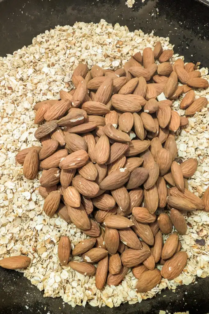 adding raw almonds to granola