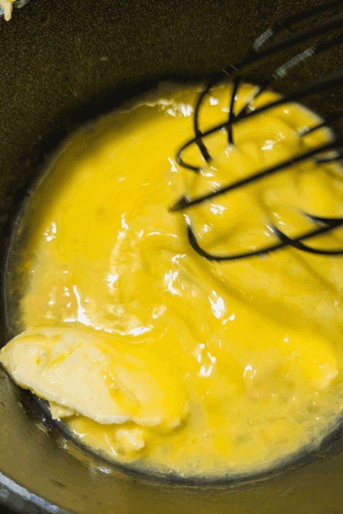 adding vinegar and whisking to melt butter