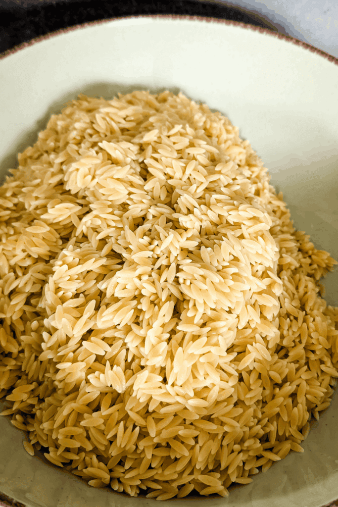 cooked orzo pasta in salad bowl