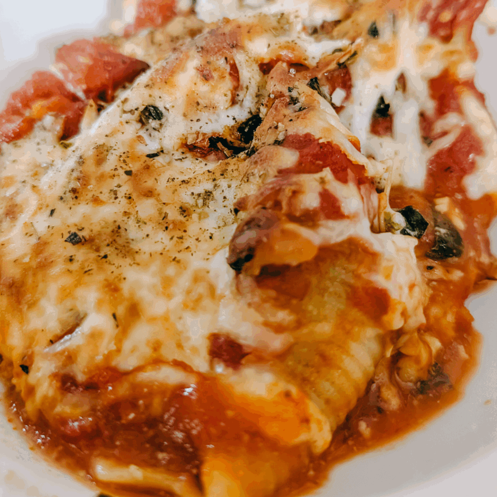 Baked stuffed pasta with cheese and herbs, ready to serve.