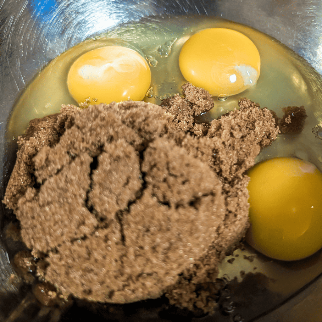 eggs and brown sugar in bowl