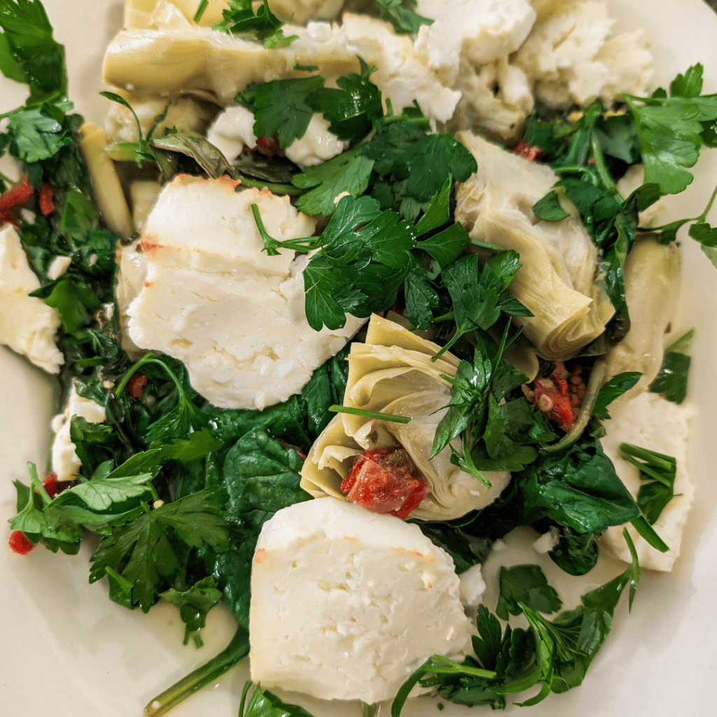 Healthy Spinach Artichoke Bake with Feta & Sun-Dried Tomatoes.