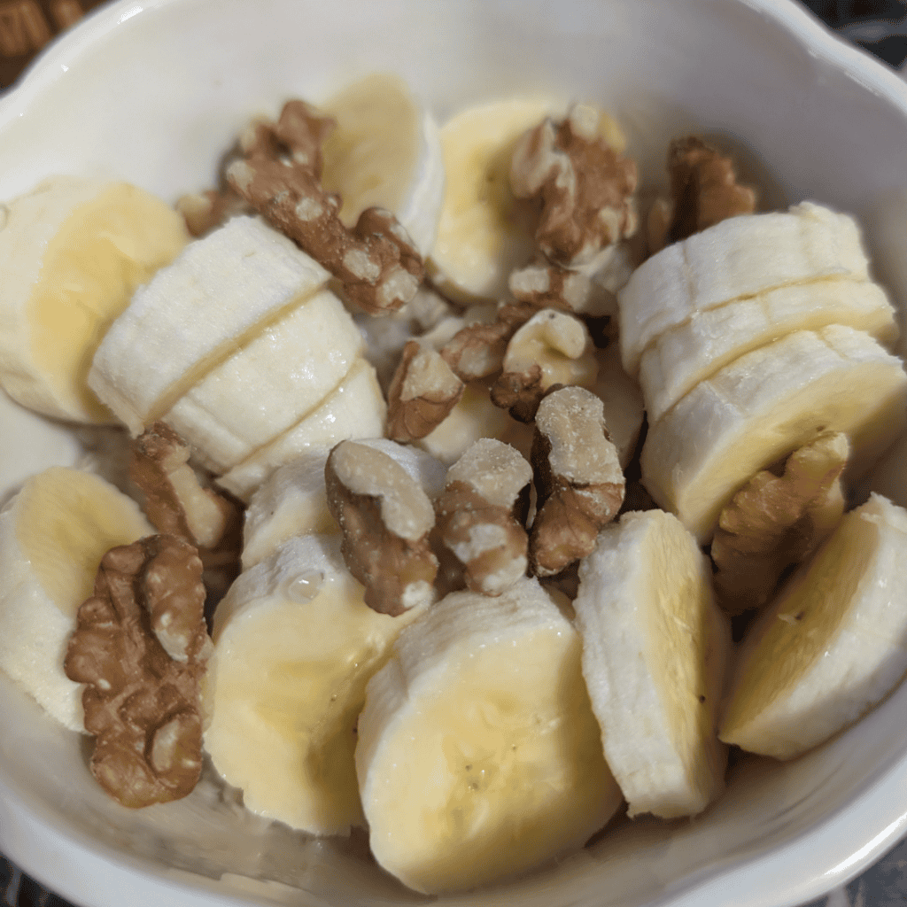 Healthy banana walnut oatmeal with creamy texture and crunchy nuts.