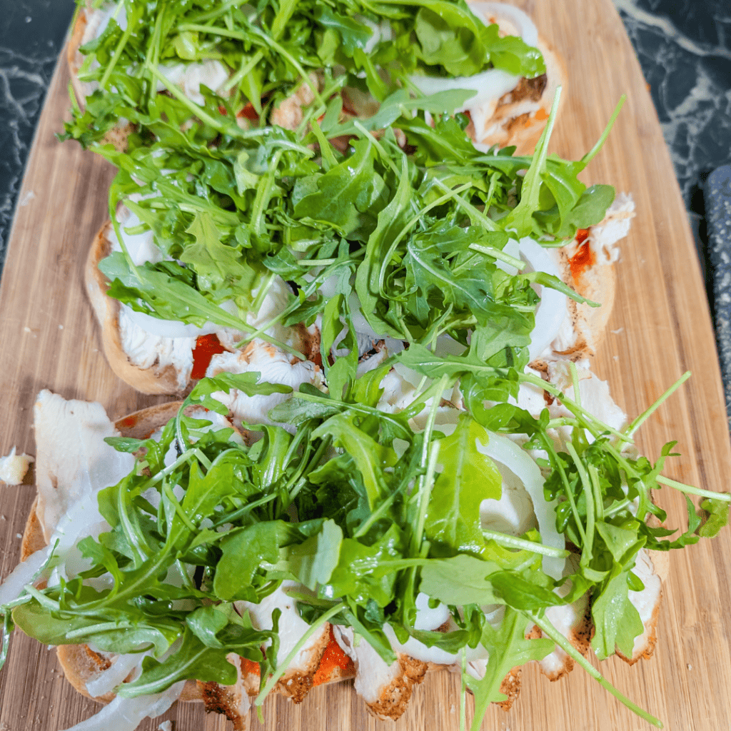 Healthy arugula salad on bread for nutritious snack or meal.