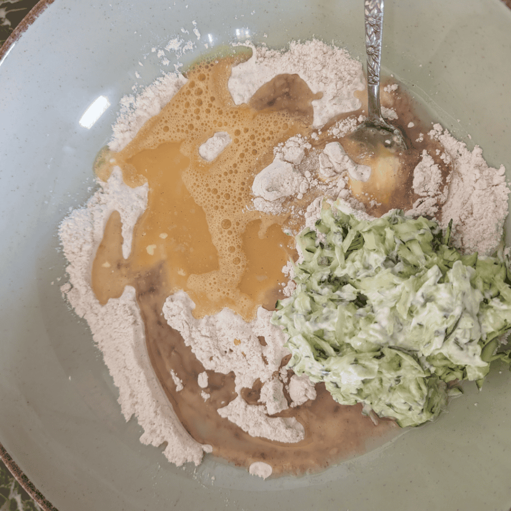 Mixing ingredients for homemade salad dressing in a bowl.