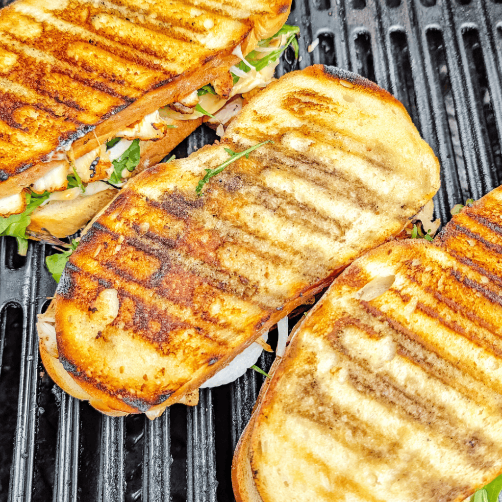 Delicious grilled chicken sandwiches with fresh lettuce on toasted bread, perfect for lunch or dinne.