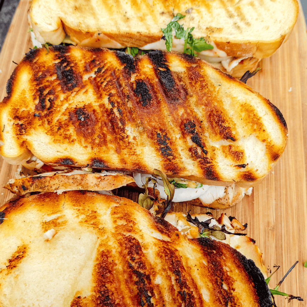 Delicious grilled chicken sandwiches with toasted bread and fresh toppings.