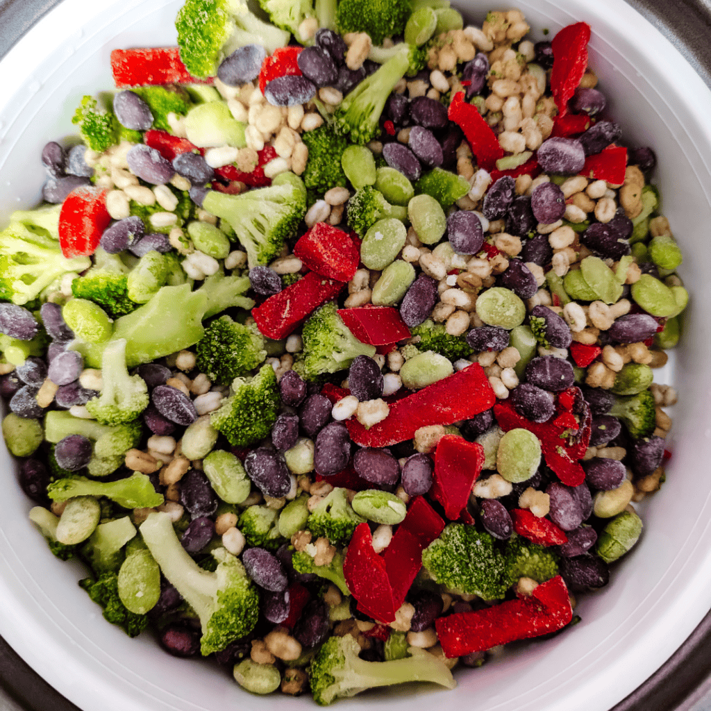 Healthy vegetable salad with broccoli, red peppers, and black beans.