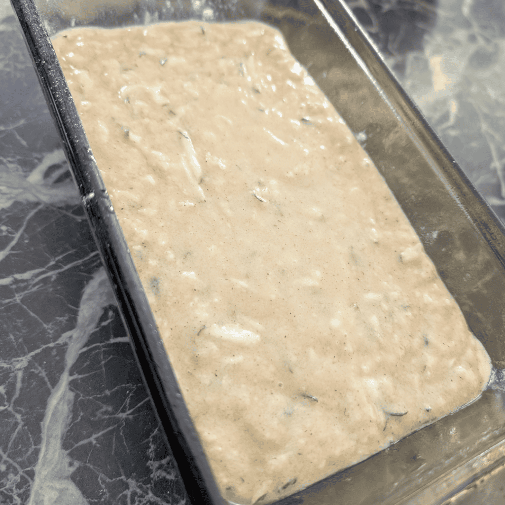 Homemade ice cream mixture in a metal container, ready for freezing.
