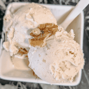 Delicious maple walnut ice cream with walnuts, perfect for dessert or a sweet treat.