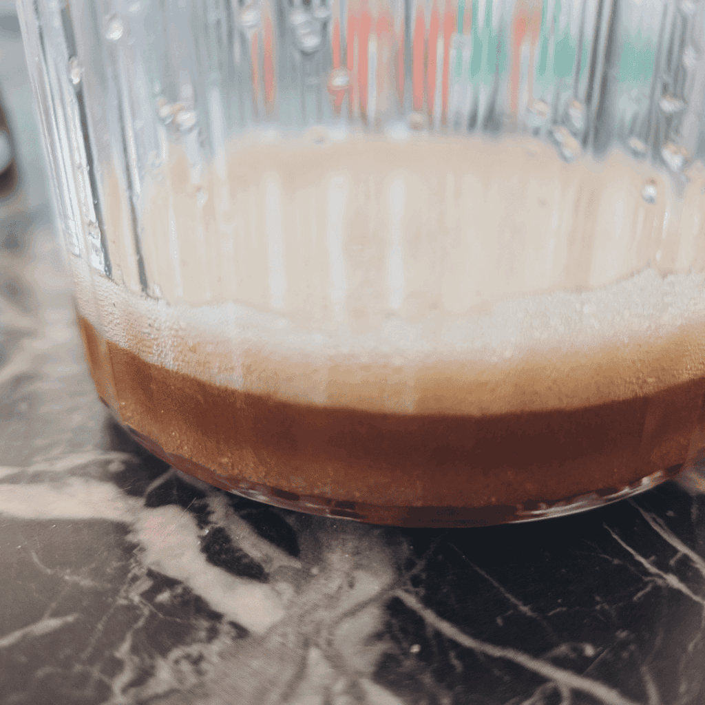 Chocolate mixture in a glass bowl, ready for baking or dessert preparation.