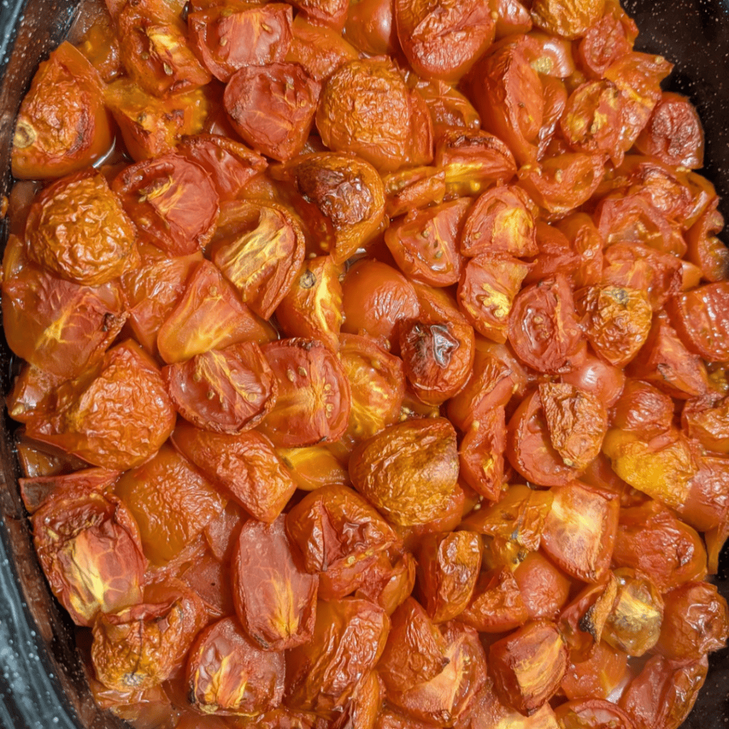 Fresh roasted tomatoes ready for making homemade tomato sauce.