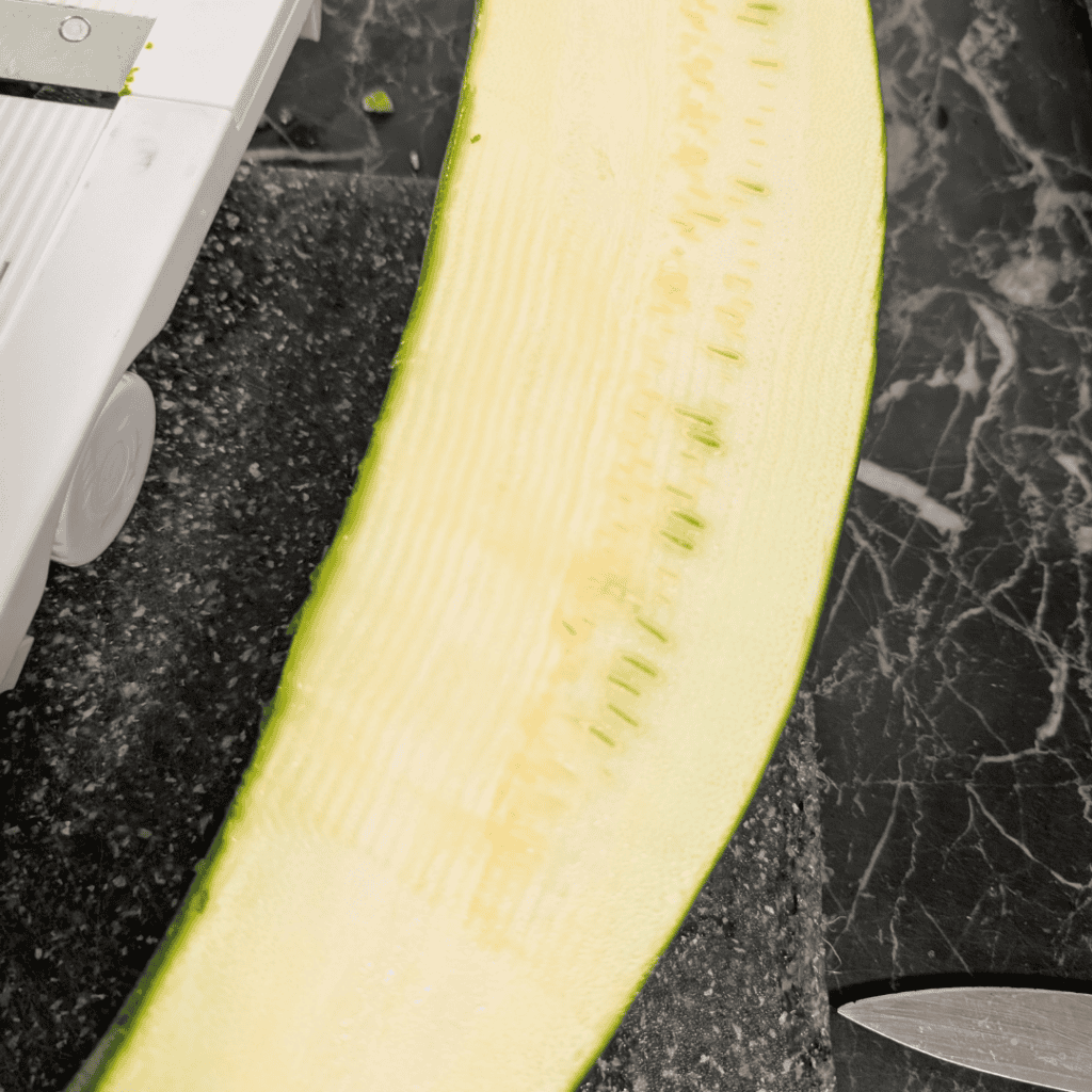 Sliced zucchini ready for zucchini lasagna with cottage cheese.
