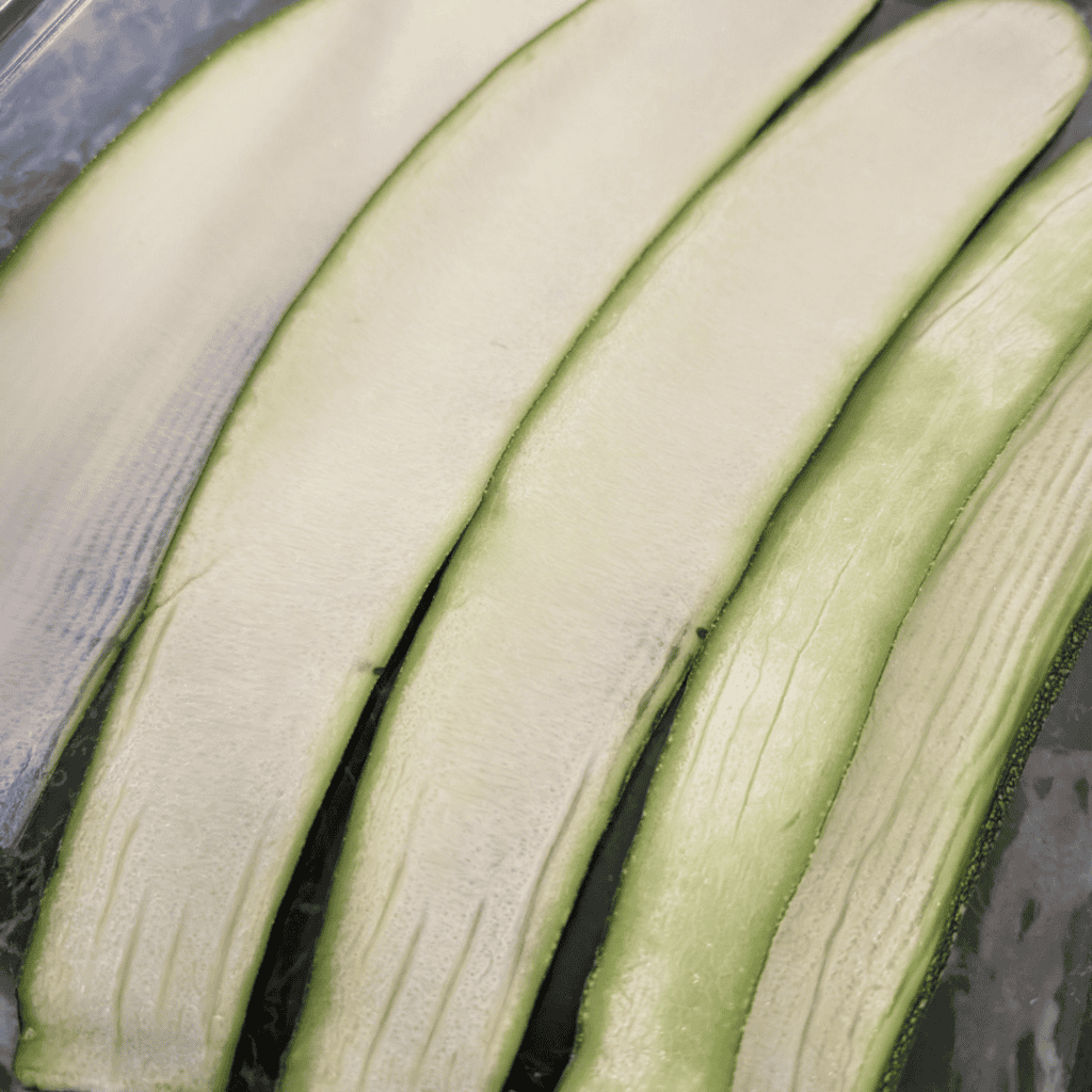 Close-up of fresh zucchini slices for zucchini lasagna with cottage cheese.